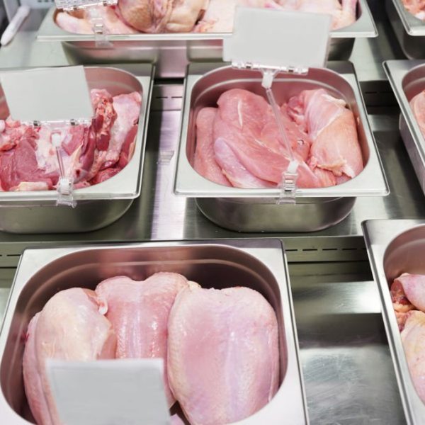 Birds Meat In Butcher Shop. Variety of raw meats of birds in the butchery showcase.